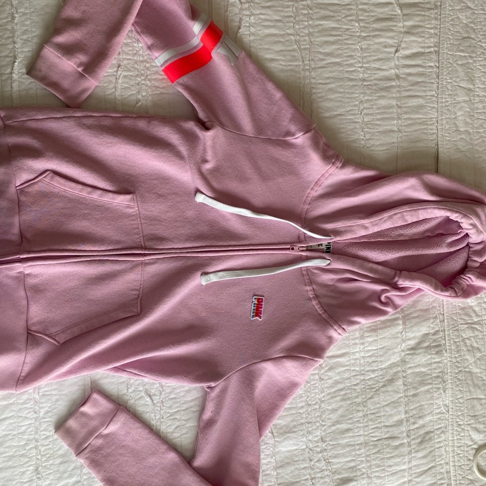 This is a Pink jacket W/  the logo and detailing